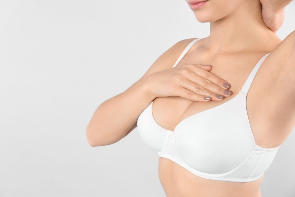 A woman after breast augmentation surgery.